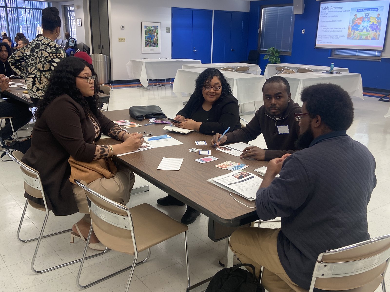 Guided Pathways Summit participants collaborating around a table